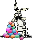 A bunny leaning on a stack of Easter Eggs
